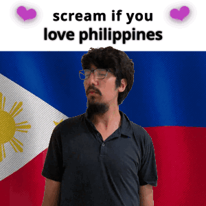 A Man With Glasses And A Beard Stands In Front Of A Filipino Flag And Says Scream If You Love Philippines GIF