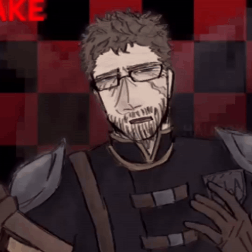 A Man With Glasses And A Beard Stands In Front Of A Red And Black Checkered Background With The Letter N On It GIF