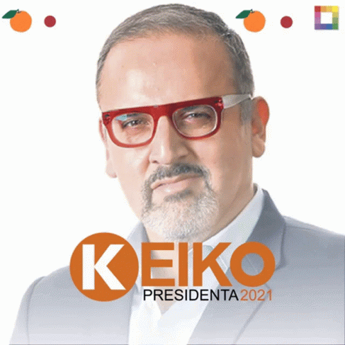 A Man With Glasses And A Beard Stands In Front Of A Sign That Says Keiko GIF