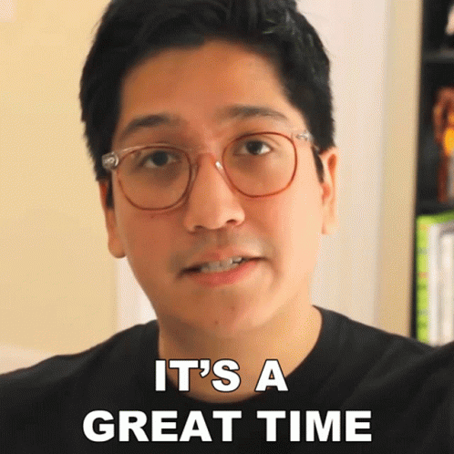 A Man With Glasses And A Black Shirt Says It 'S A Great Time GIF