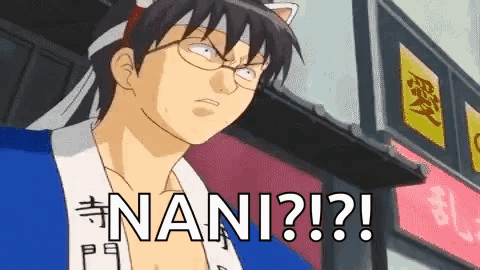 A Man With Glasses And A Cat Ear Headband Is Standing In Front Of A Building With The Word Nani Written On It . GIF
