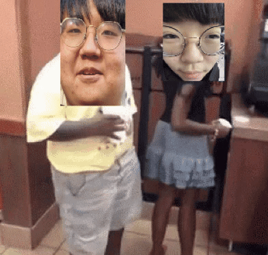 A Man With Glasses And A Girl With Glasses Are Standing Next To Each Other In A Room GIF
