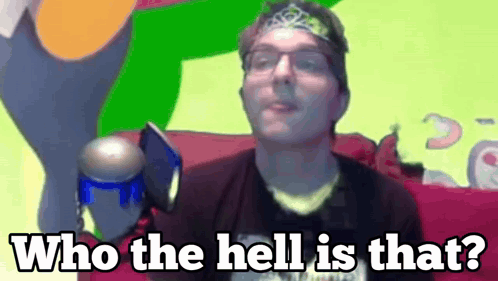 A Man With Glasses And A Headband Is Saying Who The Hell Is That .. GIF