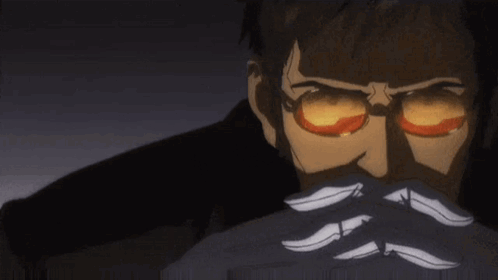 A Man With Glasses And A Mustache Is Covering His Face With His Hands In A Dark Room . GIF