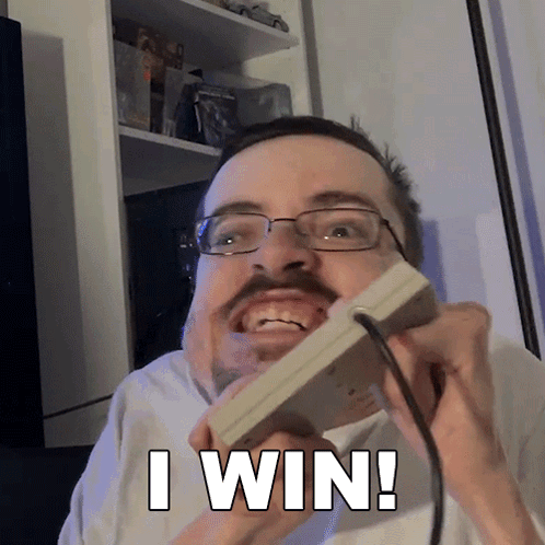 A Man With Glasses And A Mustache Is Holding A Nintendo Game Controller And Says I Win GIF