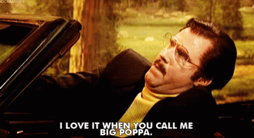 A Man With Glasses And A Mustache Is Sitting In A Car And Says I Love It When You Call Me Big Poppa GIF