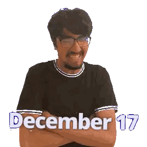 a man with glasses and a mustache is smiling with the words december 17 above him