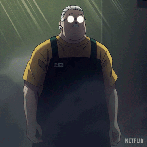 A Man With Glasses And A Mustache Is Standing In Front Of A Netflix Logo GIF