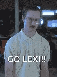 A Man With Glasses And A Mustache Is Standing In Front Of A Sign That Says Go Lex !! GIF
