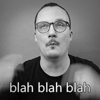 A Man With Glasses And A Mustache Is Wearing A Black Shirt And Says Blah Blah Blah GIF