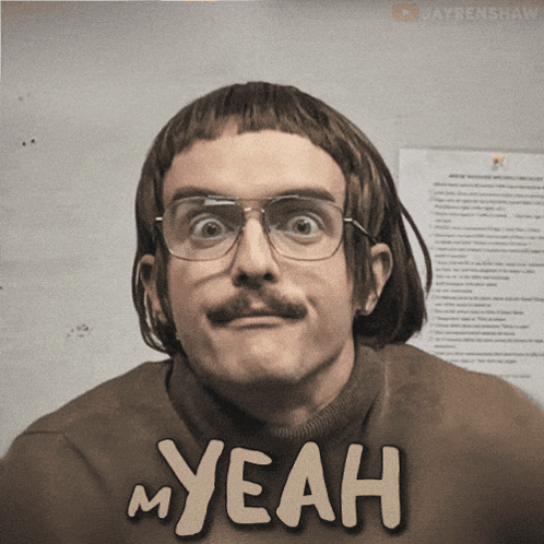 A Man With Glasses And A Mustache Is Wearing A Sweater That Says My Yeah GIF
