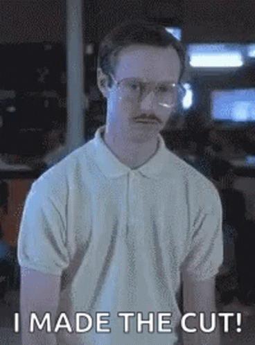 A Man With Glasses And A Mustache Is Wearing A White Polo Shirt And Saying `` I Made The Cut ! '' GIF