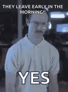 A Man With Glasses And A Mustache Is Wearing A White Shirt And Saying Yes . GIF