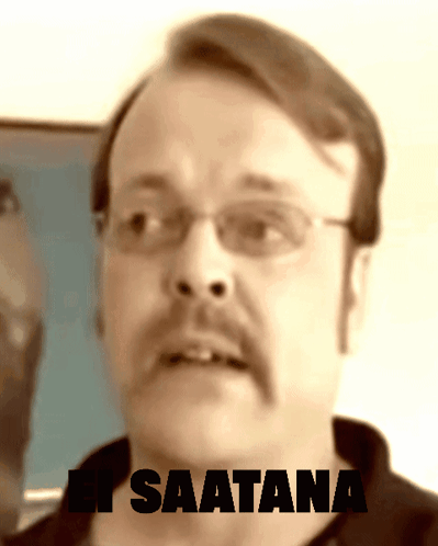 a man with glasses and a mustache says " saatana " in black letters