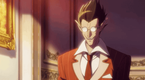A Man With Glasses And A Red Suit Stands In Front Of A Framed Picture GIF