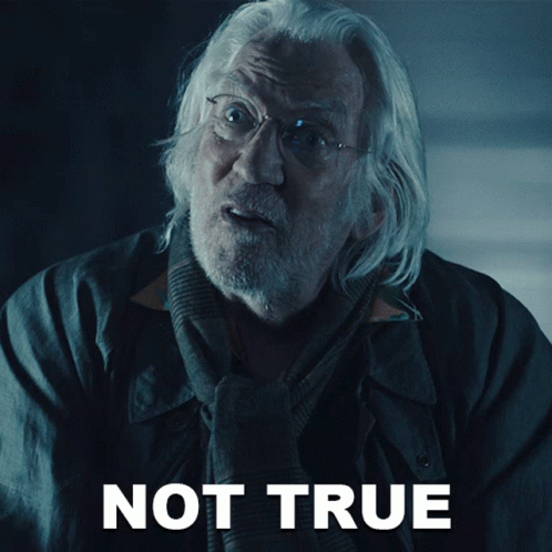 A Man With Glasses And A Scarf Is Standing In Front Of A Sign That Says Not True GIF