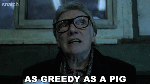 a man with glasses and a scarf says as greedy as a pig