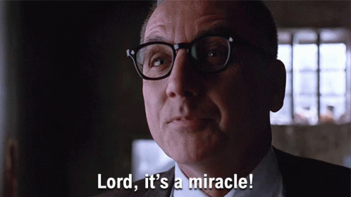 A Man With Glasses And A Suit Says Lord It 'S A Miracle GIF