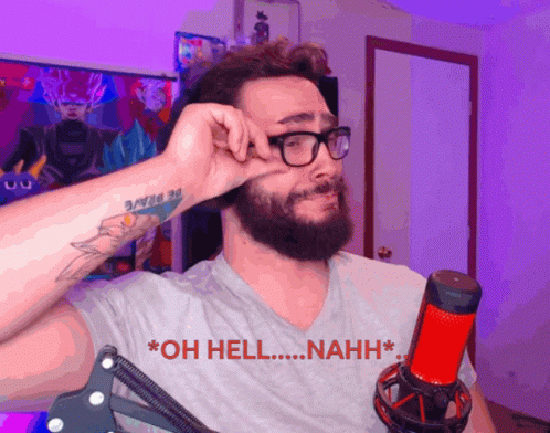 A Man With Glasses And A Tattoo On His Arm Is Standing In Front Of A Microphone And Says Oh Hell Nahh GIF