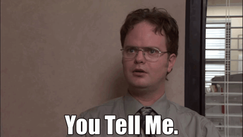 A Man With Glasses And A Tie Says " You Tell Me " GIF