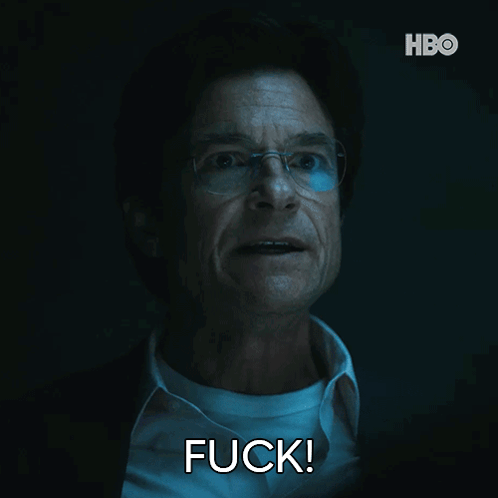 A Man With Glasses And A White Shirt Is Saying Fuck GIF