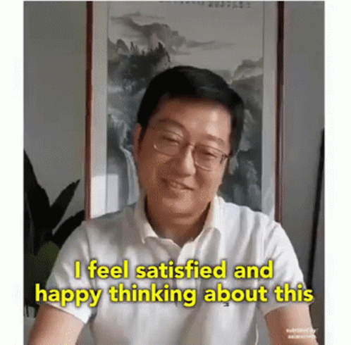 A Man With Glasses And A White Shirt Says I Feel Satisfied And Happy Thinking About This . GIF
