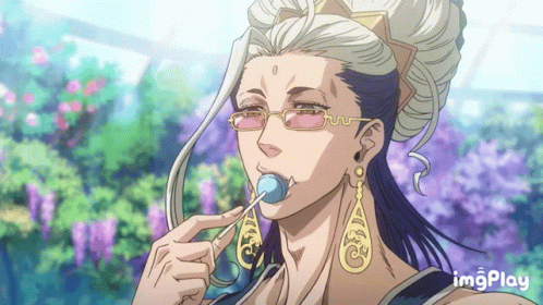 A Man With Glasses And Earrings Is Eating A Lollipop With Imgplay Written On The Bottom GIF