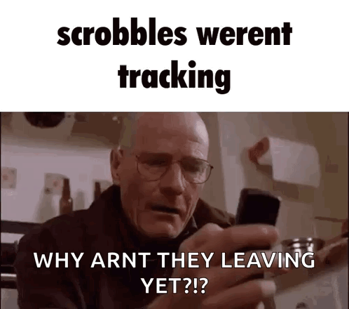 A Man With Glasses Is Holding A Cell Phone In His Hand And Asking Why Arnt They Leaving Yet ? GIF