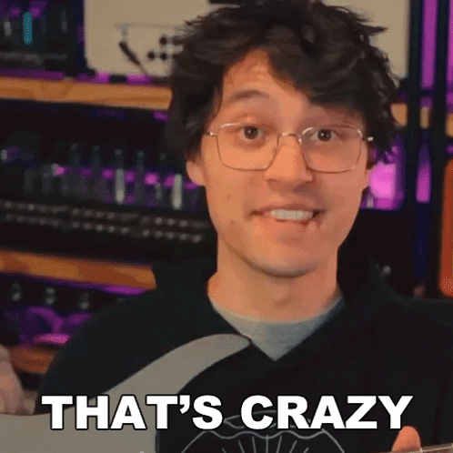 A Man With Glasses Is Holding A Guitar And Saying That 'S Crazy . GIF