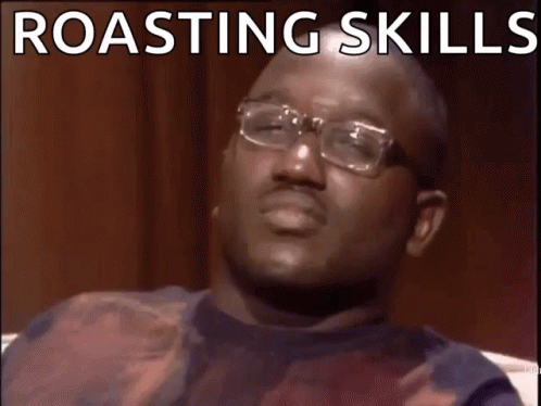 A Man With Glasses Is Making A Funny Face With The Words Roasting Skills Wack GIF