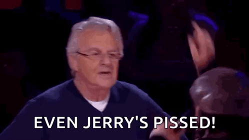 A Man With Glasses Is Sitting In Front Of A Group Of People And Says `` Even Jerry 'S Pissed ! '' GIF