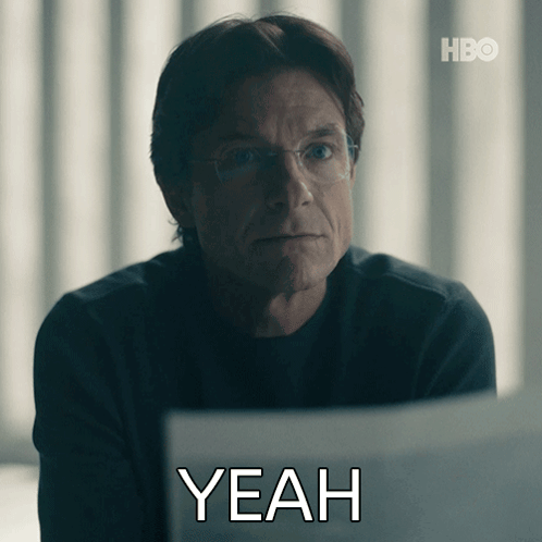 A Man With Glasses Is Sitting In Front Of A Laptop With The Word Yeah Written Below Him GIF