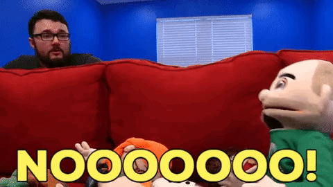 A Man With Glasses Is Sitting On A Red Couch Next To Two Puppets And Says Nooooo GIF