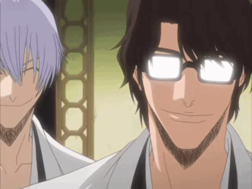 A Man With Glasses Is Smiling Next To Another Man With Purple Hair GIF