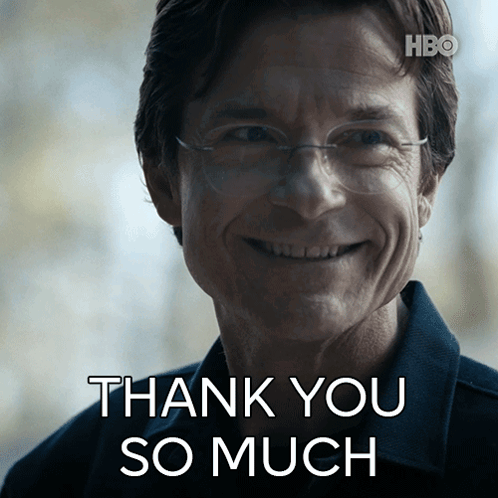 A Man With Glasses Is Smiling With The Words Thank You So Much Above Him GIF
