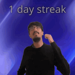 A Man With Glasses Is Standing In Front Of A Blue Background With The Words 1 Day Streak On It GIF
