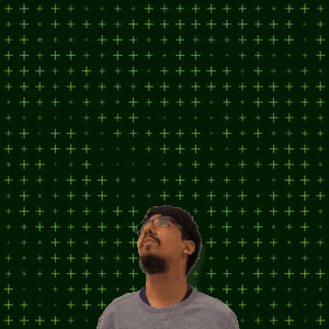 A Man With Glasses Is Standing In Front Of A Green Background With The Number 13 + 3 GIF