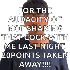 A Man With Glasses Is Standing In Front Of A Sign That Says For The Audacity Of Not Sharing GIF