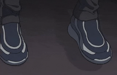 A Man With Glasses Looks Out Of A Window At Night GIF
