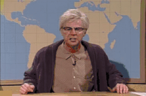A Man With Glasses Says " And That 'S The Way It Was " In Front Of A Map Of The World GIF
