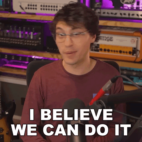 A Man With Glasses Says I Believe We Can Do It In Front Of A Microphone GIF