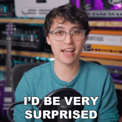 a man with glasses says " i 'd be very surprised " in front of a microphone