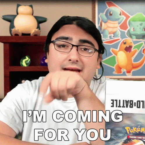 A Man With Glasses Says " I 'M Coming For You " In Front Of A Box Of Pokemon Cards GIF