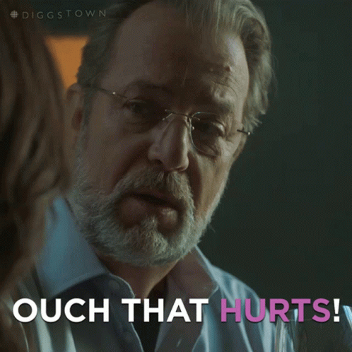 A Man With Glasses Says Ouch That Hurts In Pink Letters GIF