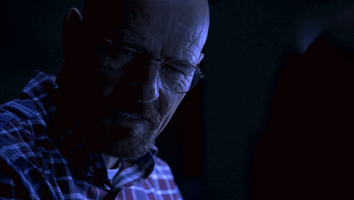 A Man With Glasses Says " You Got Me " In A Dark Room GIF