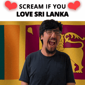A Man With Glasses Screams In Front Of A Flag That Says Scream If You Love Sri Lanka GIF
