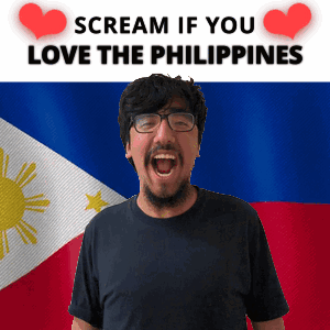 A Man With Glasses Screams In Front Of A Philippines Flag GIF