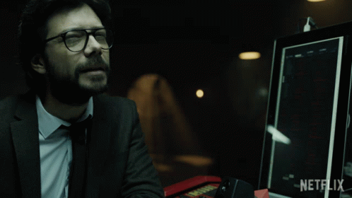 A Man With Glasses Sits In Front Of A Netflix Monitor GIF