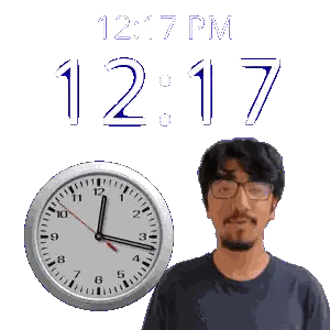 a man with glasses stands in front of a clock that says 12:17