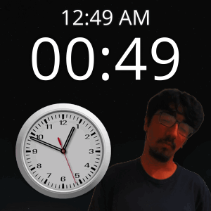 A Man With Glasses Stands In Front Of A Clock That Says 12:49 Am GIF